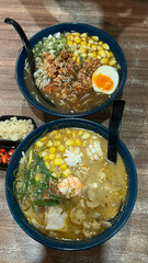 Japanese ramen noodles soup with seafood and vegetables. Asian traditional food.