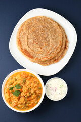 Malabar parotta with Kurma is a delicacy from the state of Kerala, Tamilnadu. Kurma is mixed veg south Indian curry with coconut milk