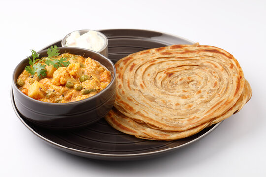 Malabar parotta with Kurma is a delicacy from the state of Kerala, Tamilnadu. Kurma is mixed veg south Indian curry with coconut milk