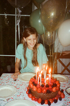 A happy girl with a birthday cake 