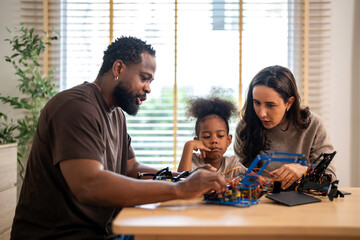 African love family, father mother and daughter learning STEM education, science experiment, robotics toy, technology and innovation interactive learning, creativity and development at home