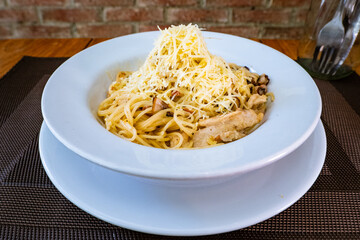 spaghetti with chicken, mushrooms, and Parmesan cheese