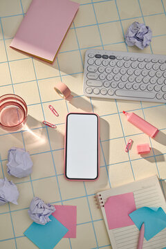 Business office gadgets with stationery and white screen phone