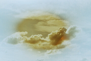 Sky with clouds and yellow circle