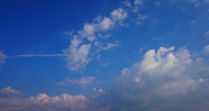 Beautiful blue sky with unique white clouds creates a dramatic and cool sky view.