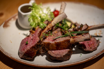 Grilled lamb chop served on plate