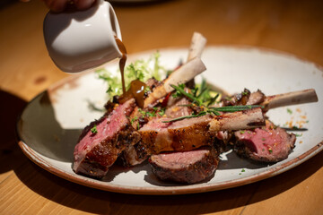 Grilled lamb chop served on plate