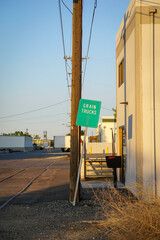 Grain trucks sign in industrial area
