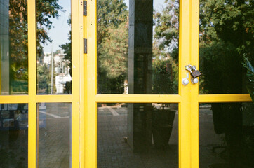 Locked Yellow Door Symbolizing Closure And Uncertainty