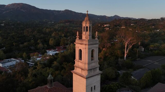 Saint Anthony&rsquo;s Seminary Santa Barbara California bell tower and mountain backdrop 4k aerial drone video