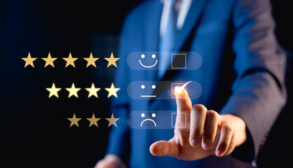 Businessman surveys customer satisfaction ratings via online application. Customers can evaluate...