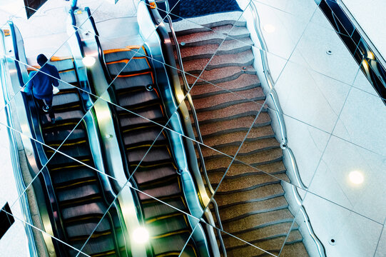Glass escalator reflection