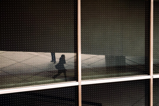 Reflection of woman walking 