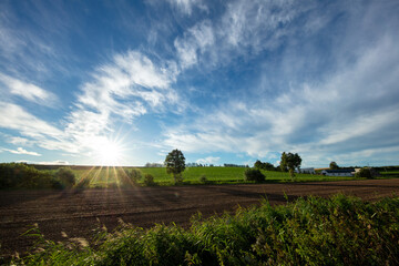 The sun shining on the hills