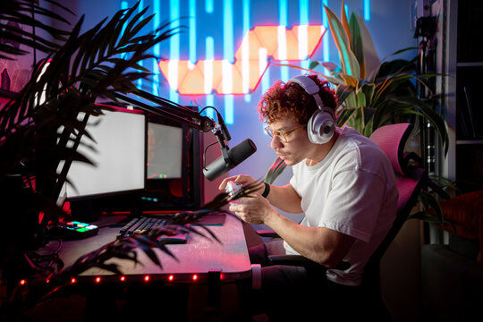 Streamer playing video game on game controller