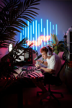 Streamer playing video game on game controller