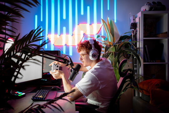 Streamer playing video game on game controller