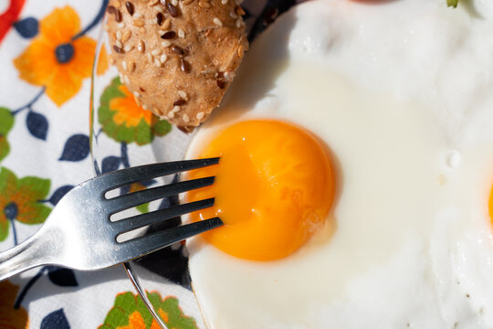 Eating fried eggs