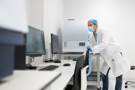 Scientist Using Scientific Equipement In The Lab