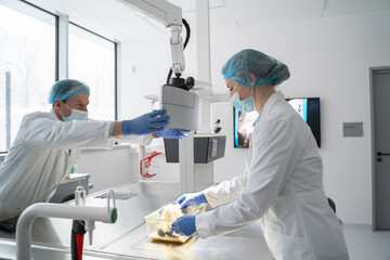 Scientists Working In Non-Invasive Behavioral Study Lab