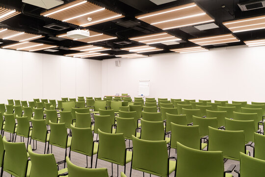 Conference Room with Neatly Arranged Green Chairs

