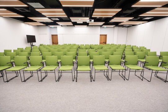 Modern Conference Hall with Green Chairs