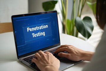 Cybersecurity expert performing penetration testing on laptop computer for system security analysis