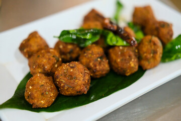 Lab Moo Tod or Crispy Larb Moo, Meatball of chopped pork mix with Thai spicy curry. Served on plate.