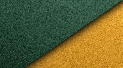 Close-up view of two textured surfaces, a deep teal green and a mustard yellow, meeting at a diagonal.  The texture appears slightly fuzzy