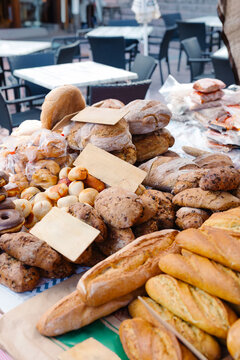 Close-up of artisan breads displayed on a market stall