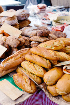 Artisan breads placed in a market stall in the Asturias