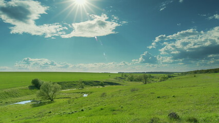 A Beautiful Lush Green Landscape Illuminated by Bright and Warm Sunlight, Captivating All Time...