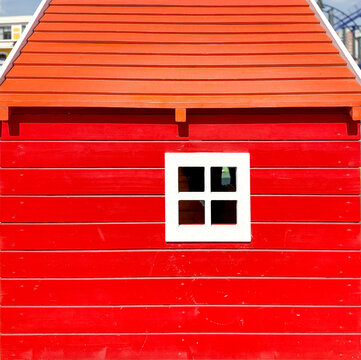 Red Wooden Wall with White Window and Modern Architectural Design