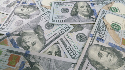 Tall stacks of American Hundred Dollar Bills accumulating over time, symbolizing wealth and value