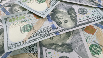 A large arrangement of U.S. Dollar Bills serving as a detailed background visual image