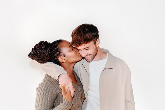 Tender couple kissing on the cheek
