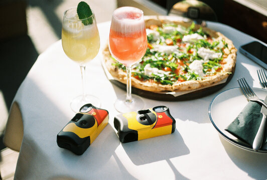 Disposable Cameras with Drinks and Pizza

