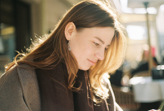 Woman Enjoying a Sunny Day Outdoors with Natural Light
