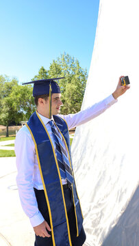 Graduating Young Man Taking Selfie