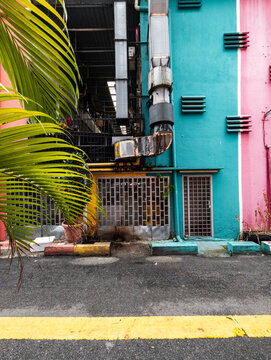 Ductwork on alleyway painted walls