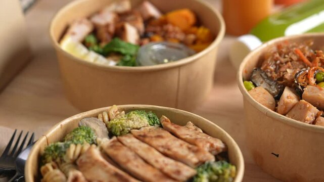 Having a lunch break at the office with delicious Healthy food delivery in take away boxes, Healthy eating concept. dolly shot.