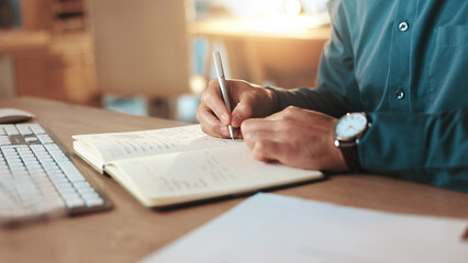 Business person, hands or writing with book at night for reminder, schedule or notes at office...