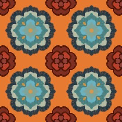 Geometric floral pattern with alternating designs on an orange background
