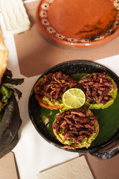 Sopes served with crickets