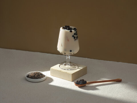 Delicious bubble tea with tapioca pearls in a stylish glass