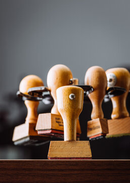 Wooden Rubber stamp on office desk. 