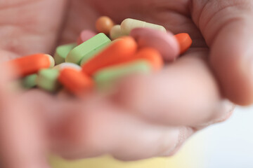 a lot of pills in the palm of a person's hand, medical background