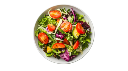 A top view of a salad with lettuce tomatoes and other greens in a white bowl isolated on transparent background