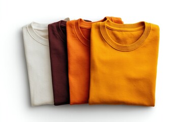 Four folded t-shirts in varying autumnal colors