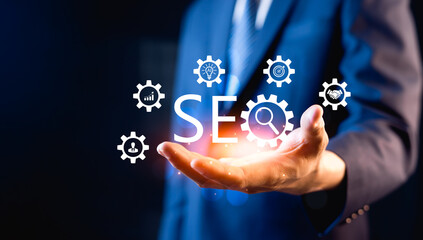 Businessman holding virtual SEO icon to analyze your website performance for search engine ranking....